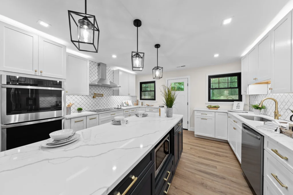 White kitchen with island and pendant lighting