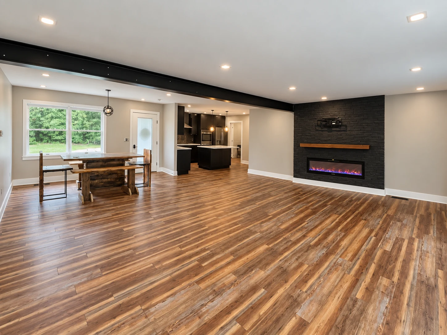 Finished open living and dining space connecting to a kitchen